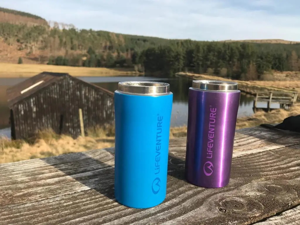 two blue and purple tumblers sitting on a table at Cairnhill Lodge - Award-Winning Luxury Highland Retreat in Blairgowrie