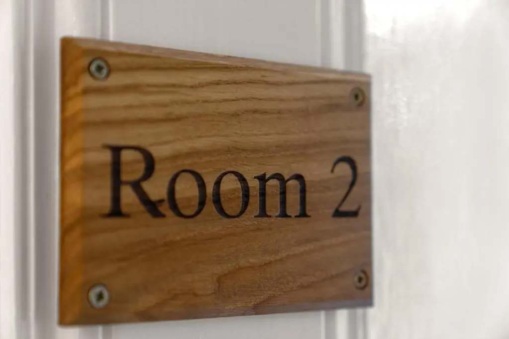 a wooden sign with the word room on a door at mySTAYINN Strathblane 7 Bedroom Full House - Inverness in Inverness
