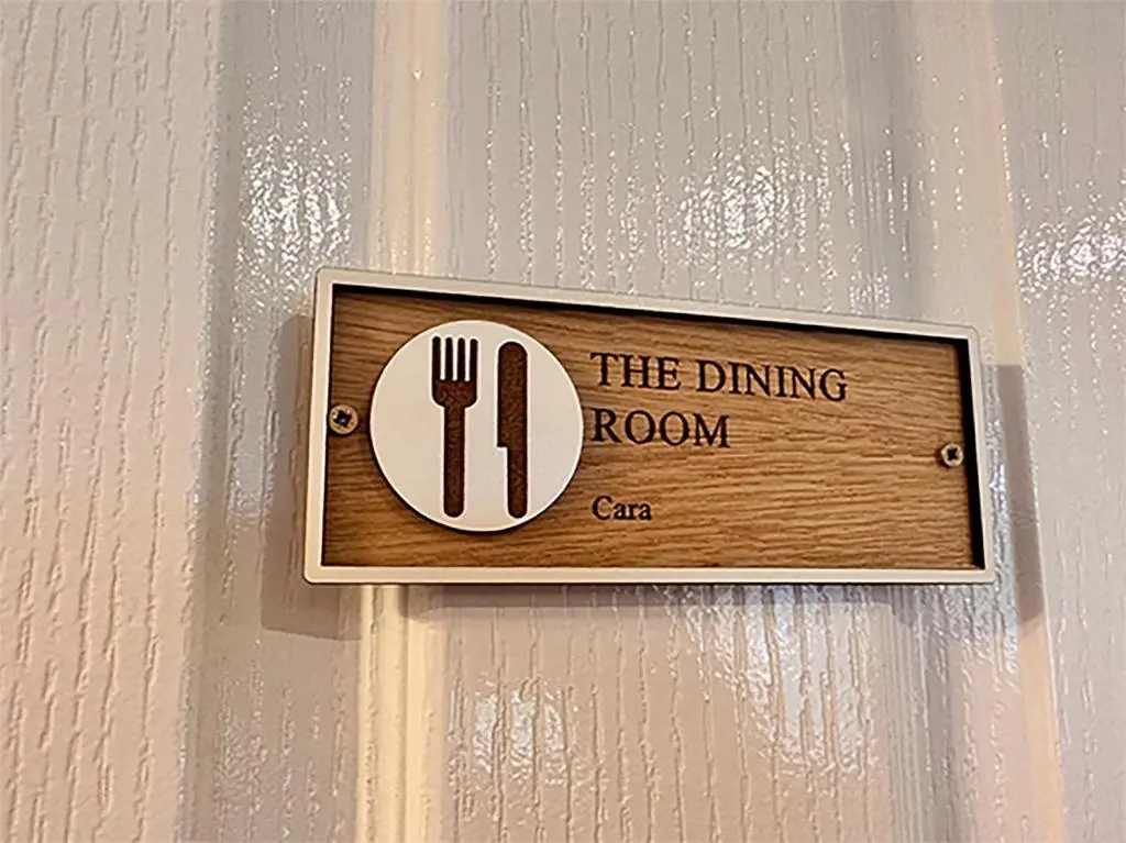 a sign on a wall that says the dining room car at Forces Manor in Kincraig