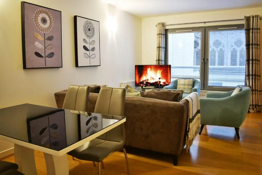 a living room with a couch and a fireplace at Cannon Point BW7 in Fort Augustus