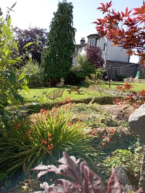 a garden with a house in the background at Abbeyfield B&B in Dufftown