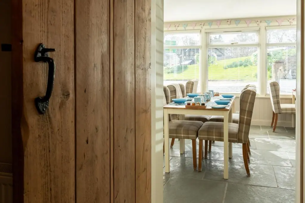 a dining room with a table and chairs at Bridgend House B&B in Drumnadrochit