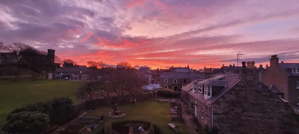 a view of a city with a sunset at Old Police Station, Portsoy in Portsoy