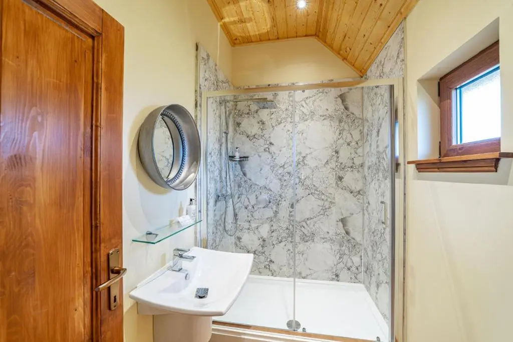 a bathroom with a sink and a shower at Wildcat Lodge in Cray
