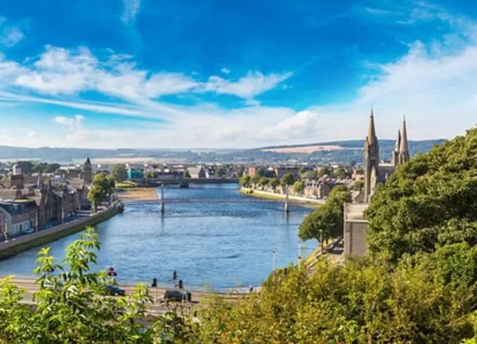 a view of a river with a city at Ness Riverfront Holiday Home - City Centre in Inverness