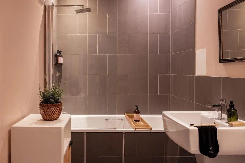 a bathroom with a sink and a bath tub at Number 2 Steading Cottage in Banchory
