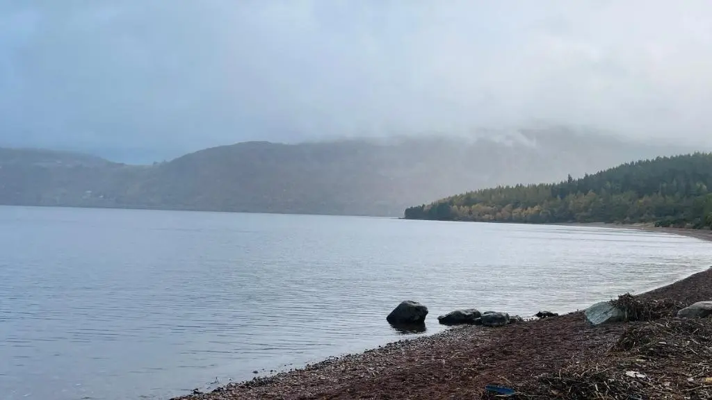 a large body of water with rocks on the shore at Loch Ness Hideaway Pod in Lewiston
