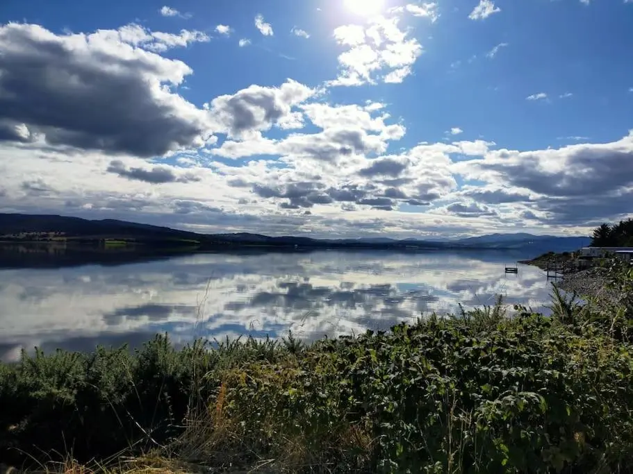 a view of a lake with clouds in the sky at Spacious Sea View Home 5 miles from Inverness in North Kessock
