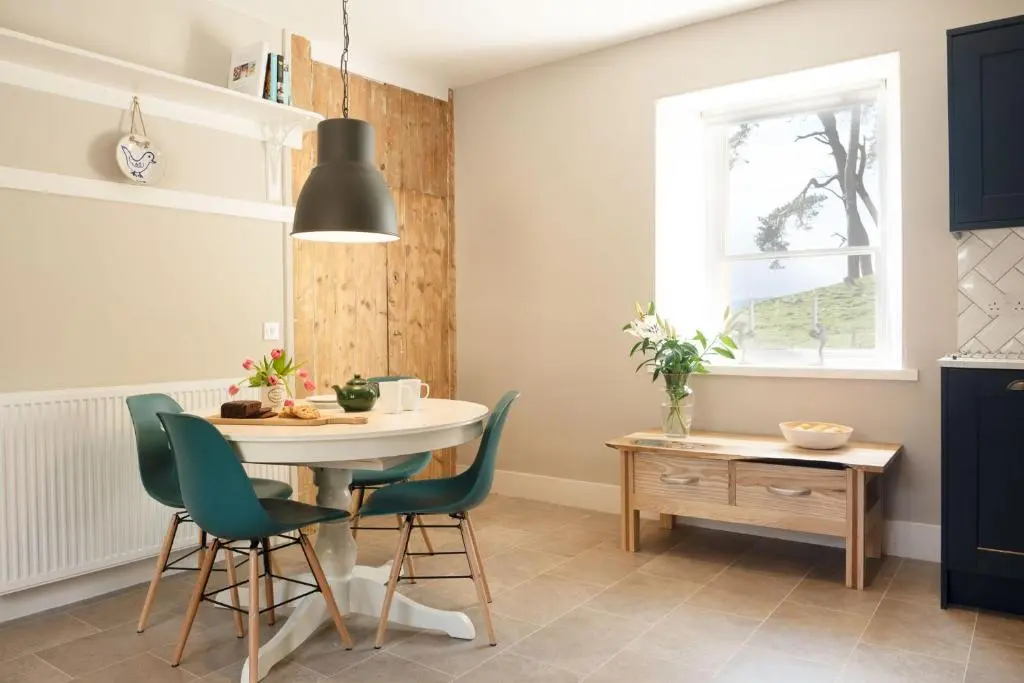 a kitchen with a table and chairs and a window at Kincraig House - Seasgair Lodges in Kincraig
